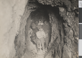 Photograph of four miners inside a mine shaft, probably in Nevada, circa 1900s