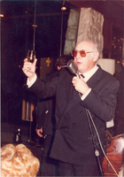 Photograph of Jay Sarno making a toast, circa 1980