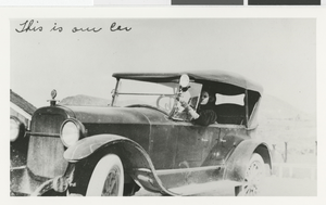 Photograph of Dorothy Andre in her car, 1930s