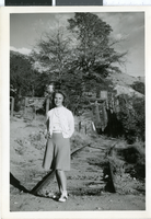 Photograph of Mary Toleno in front of railroad ruins, Nevada, 1930-1940