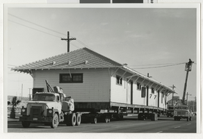 Photograph of vehicles transporting Union Pacific Railroad Depot from Boulder City to Henderson (Nev.), 1974
