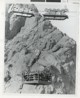 Photograph of workmen in an overhead structure, Hoover Dam, 1930s