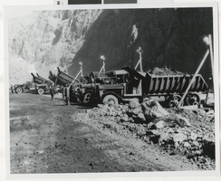 Photograph of dam workers and trucks, Hoover Dam, 1930s