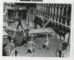Photograph of construction equipment releasing concrete, Hoover Dam, 1930s.