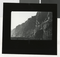 Photograph of the canyon wall and derrick at Hoover Dam, 1934