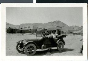 Photograph of Mr. Corwell, Mrs. Corwell, and friend in a car, Rhyolite (Nev.), circa 1925