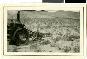 Photograph of J. Irving Crowell on "Old Dinah" machine near Rhyolite (Nev.), circa 1925