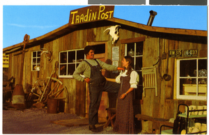 Postcard of Evan and Kathy Thompson in front of Tradin' Post, Rhyolite (Nev.), 1970s