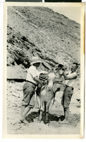 Photograph of two men and a burro at Keane Wonder Mine (Calif.), circa 1925