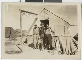 Photograph of George Sanders and two men in front of the Gold Bar Club, Wahmonie (Nev.), 1928-1929