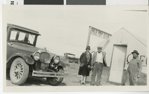 Photograph of three people outside of Gold Bar Club, Wahmonie (Nev.), 1928-1929