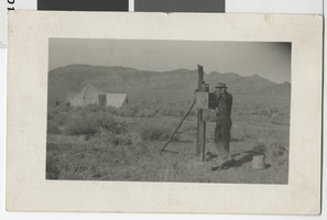 Postcard of Clifford Lake talking on the telephone, Goodsprings (Nev.), March 13, 1913