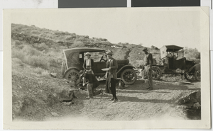 Photograph of Robert and Mary Lake and others near automobiles, 1910-1920