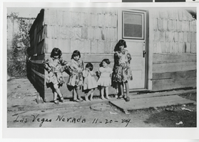 Photograph of five children standing in front of a building, Las Vegas (Nev.), November 20, 1929