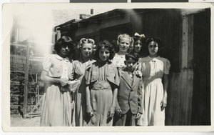 Photograph of four of the Rivero children with two friends and their cousin, 1940s