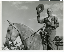 Photograph of Vail Pittman riding a horse in the Helldorado Parade, Las Vegas (Nev.), mid-1940s