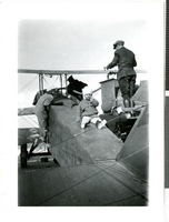 Photograph of people fueling Wiley Post's plane, Millers (Nev.), 1922