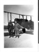 Photograph of Wiley Post and man in front of Post's plane, Millers (Nev.), 1922