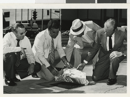 Photograph of John Cahlan and others at Western Airlines plaque, Las Vegas, Nevada, September 23, 1980