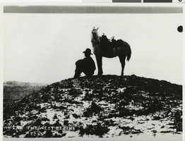 Photograph of a man and horse in the Nevada desert, 1940s