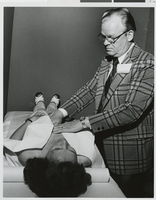 Photograph of Dr. Gerald Jones performing an exam, Las Vegas (Nev.), June 1977