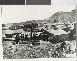 Photograph of Grutt Hill-Truitt mining company's workers standing next to Rawhide's gold mine (Nev.), mid-1908
