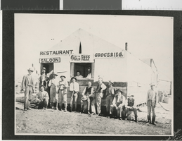 Photograph of people outside Gold Reef's first business (Nev.), 1908