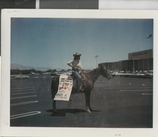 Photograph of a woman on a horseback with a sign for "Cat Ballou," Las Vegas (Nev.), mid 1960s