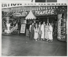 Photograph of people in clown costumes in front of the Fremont Theatre, Las Vegas (Nev.), 1959