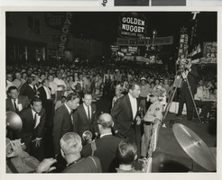 Photograph of Dean Martin and Frank Sinatra in front of a large crowd in front of the Fremont Theatre, Las Vegas (Nev.), 1960