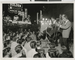 Photograph of a band entertaining a crowd on Fremont Street, Las Vegas (Nev.), 1956