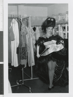 Photograph of a showgirl in costume in a dressing room, Las Vegas (Nev.), 1957-1960s