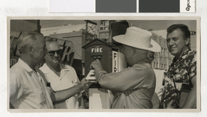 Photograph of C. D. Baker and others testing a fire alarm, Las Vegas (Nev.), August 9, 1957