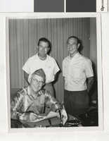 Photograph of C. D. Baker signing a proclamation, Las Vegas (Nev.), 1950s