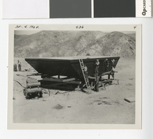 Photograph of men working on a scow, Lake Mead, 1935-1940