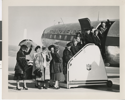 Photograph of people boarding an airplane, late 1940s-1950s