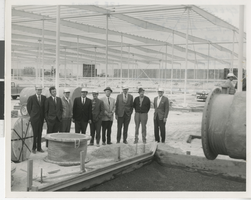 Photograph of businessmen in hard hats at reservoir site, Las Vegas (Nev.), January 14, 1970