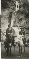 Photograph of Jean Fayle and someone else riding on donkeys, Colorado Springs (Colo.), 1930-1950