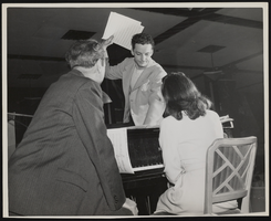 Photograph of Donn Arden discussing music, 1940s