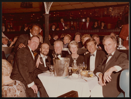 Photograph of Donn Arden, Margaret Kelly, and others at Lido dinner party, Paris (FRA), 1970s