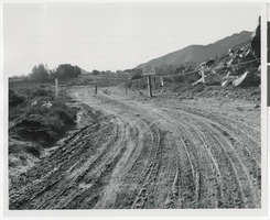 Photograph of closed road and railroad station ruins, Baker (Calif.), early 1900s