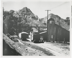 Photograph of train station and caboose, (Nev.), 1890-1910