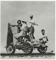 Photograph of people on mine cart, Death Valley Junction (Calif.), 1910