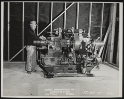 Photograph of worker installing grinder machine, Henderson (Nev.), December 29, 1941