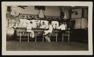 Photograph of people and a dog inside the Commissary, Boulder City (Nev.), approximately 19301-1936