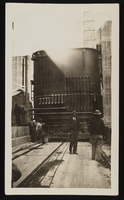 Photograph of men near large steel machinery, Hoover Dam, approximately 1931-1936