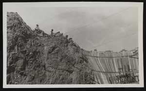 Photograph of construction towers and lines at the base of Hoover Dam, approximately 1931-1936