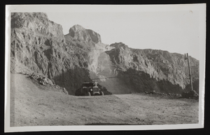 Photograph of a car parked in the desert, Hoover Dam, approximately 1931-1936