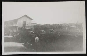 Photograph of trucks parked outside construction camp, Boulder City (Nev.), approximately 1931-1936