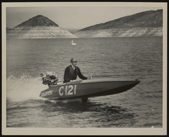 Photograph of a man on a motorboat, Lake Mead, approximately 1931-1939
